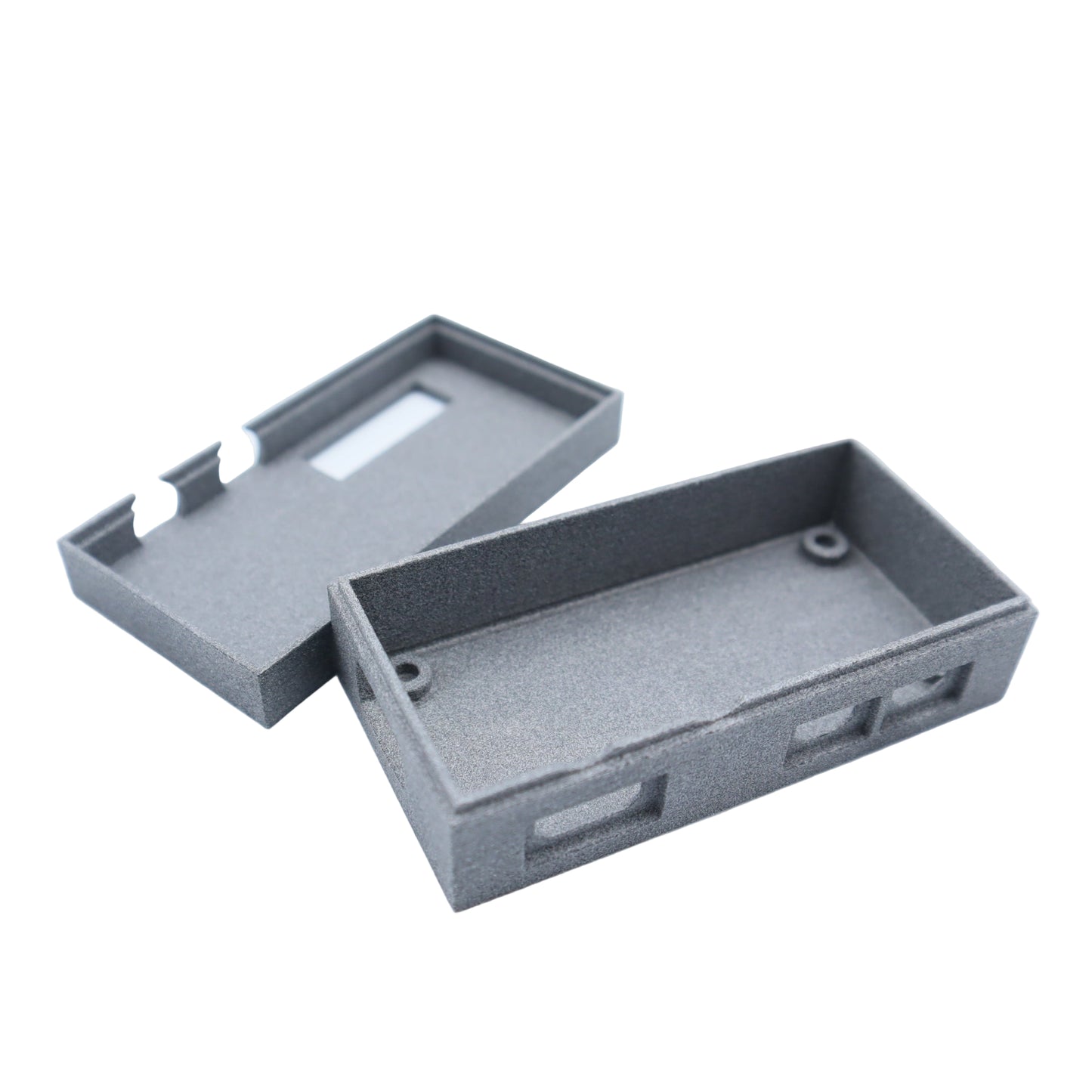 Two gray rectangular plastic cases on a white background
